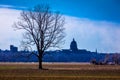 MARCH 4, 2017 - JEFFERSON CITY - MISSOURI - Missouri state capitol building in Jefferson City - seen from farm field and tree in f Royalty Free Stock Photo