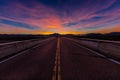 MARCH 12, 2017, LAS VEGAS, NV - Highway overpass above Interstate 15, south of Las Vegas, Nevada at sunset with yellowline Royalty Free Stock Photo