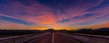 MARCH 12, 2017, LAS VEGAS, NV - Highway overpass above Interstate 15, south of Las Vegas, Nevada at sunset with yellowline Royalty Free Stock Photo