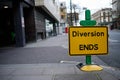 Diversion ends sign on pavement Royalty Free Stock Photo