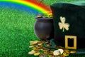 March meme and Happy St patrick`s day concept with green funny leprechaun hat with shamrock, pot of gold at the end of the rainbo Royalty Free Stock Photo