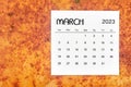 The March 2023 Monthly calendar for 2023 year on red grunge background