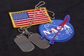 15 March 2018 - The National Aeronautics and Space Administration (NASA) emblem patch and dog tags on black uniform Royalty Free Stock Photo