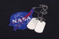 15 March 2018 - The National Aeronautics and Space Administration (NASA) emblem patch and dog tags on black uniform Royalty Free Stock Photo