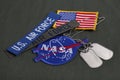 15 March 2018 - The National Aeronautics and Space Administration (NASA) emblem patch, dog tags, US AIR FORCE branch tape and US Royalty Free Stock Photo