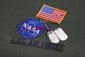 15 March 2018 - The National Aeronautics and Space Administration (NASA) emblem patch, dog tags, US AIR FORCE branch tape and US Royalty Free Stock Photo