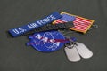 15 March 2018 - The National Aeronautics and Space Administration (NASA) emblem patch, dog tags, US AIR FORCE branch tape and US Royalty Free Stock Photo