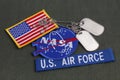 15 March 2018 - The National Aeronautics and Space Administration (NASA) emblem patch, dog tags, US AIR FORCE branch tape and US Royalty Free Stock Photo