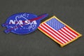 15 March 2018 - The National Aeronautics and Space Administration (NASA) emblem patch and US Flag patch on green uniform Royalty Free Stock Photo