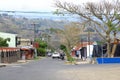 March 3 2023 - Orosi, Costa Rica: Street view of a small town with people walking on the narrow streets in the local neighbourhood Royalty Free Stock Photo