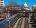 MARCH 26, 2108 - Passenger Metro train with US Capitol in background approaches L'enfant Plaza. L'enfant, modern