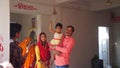 Hindu religious family member offering prayer in temple. Family members in Religious temple. Toddler girl enjoying father lap