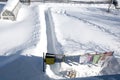 March 23, Rodniki, Russia 2021. The path leading to the house through the snowdrifts. Summer cottage in the snow in the