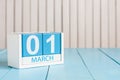 March 1st. Image of march 1 wooden color calendar on white background. First spring day, empty space for text