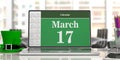 March 17, St Patricks Day on computer screen and leprechaun hat, blur office background. 3d illustration Royalty Free Stock Photo