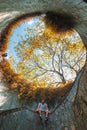 2019 March 1st, Singapore, fort canning park - A European man sat on the wall in the famous tunnel in the garden