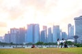 2019 March 1st, Singapore, Marina Barrage - Panorama view of the city buildings and people doing their activities at sunset Royalty Free Stock Photo