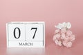 March 07th. Day 7 of month. Calendar cube on modern pink background, concept of bussines and an importent event