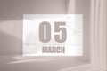 march 05. 05th day of the month, calendar date. White sheet of paper with numbers on minimalistic pink background with