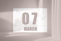 march 07. 07th day of the month, calendar date. White sheet of paper with numbers on minimalistic pink background with