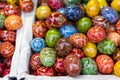 MARCH 25, 2016: Traditional wooden decorative eggs sold at traditional Easter markets on Old Towns Square in Prague