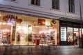 The famous street Graben at night with the lights of shops and crowds of tourists walking around