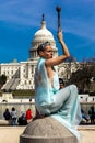 MARCH 24, 2018 - Washington DC, Female poses like Statue of Liberty in front of US Capitol,. Pop, capitol Royalty Free Stock Photo