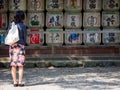 Woman looks at sake barrel offerings, Nagoya, Japan