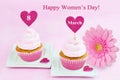 8 March Women's Day pink greeting card with cupcake, heart and gerbera