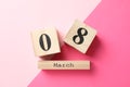 8 march wooden calendar on two tone background