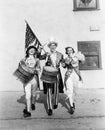 Marching band performing in a parade with an American flag Royalty Free Stock Photo