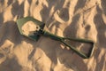 Marching shovel. shovel in the sand. green shovel Royalty Free Stock Photo