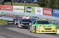 Marcos Ambrose leads the cars through the Esses