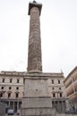 Marcus Aurelius column in front of Palazzo Wedekind at Piazza Colonna in Rome, Italy Royalty Free Stock Photo