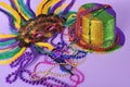 Mardi Gras feathered masks party hat beads Royalty Free Stock Photo