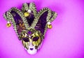 Mardi Gras Festival. Luxurious masquerade Venetian carnival mask on purple background