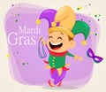 Mardi Gras jester holding necklaces and mask Royalty Free Stock Photo