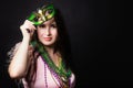 Mardi gras people. Woman with a carnival mask and beads on the black background with copy space Royalty Free Stock Photo