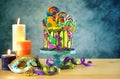 Mardi Gras theme on-trend candyland fantasy drip cake. Royalty Free Stock Photo