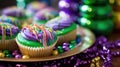 Mardi Gras Treats food and drinks in purple, green, yellow colors background. Masquerade festival carnival masks, gold Royalty Free Stock Photo