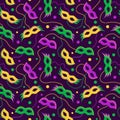 Mardi Gras vector seamless pattern with carnival masks and beads on dark purple background. Royalty Free Stock Photo