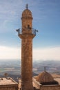 Mardin mosque minaret on the rural background