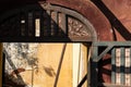 Detail of a floral wooden carving on the window of a ruined Portuguese era house