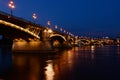 The Margaret bridge in Budapest with reflections at blue hour. closeup view.