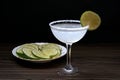 Margarita cocktail. Classic tequila drink with lime juice in salt rim cocktail glass and lime sliced, Royalty Free Stock Photo