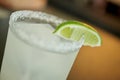 Margarita cocktail consisting of tequila, orange liqueur, and lime juice served with salt on the rim of the glass, slice of lime Royalty Free Stock Photo