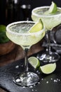 Margarita cocktail with ice, lime and salt rim Royalty Free Stock Photo