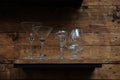margarita,martini and brandy glasses on classic wooden shelf