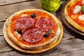 Margarita and pepperoni pizza with tomatoes, mozzarella cheese and basil Royalty Free Stock Photo