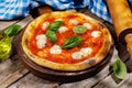 Margarita pizza with tomatoes, mozzarella cheese and basil Royalty Free Stock Photo